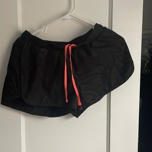 Black athletic shirts with neon drawstring.